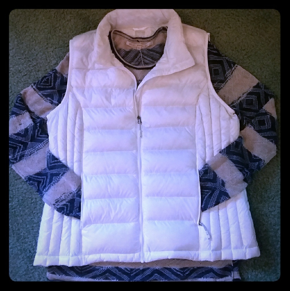 White vest with blue and tan striped long sleeve